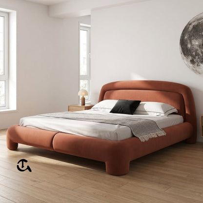 Le Cocon d'Ambre
Une chambre à coucher chaleureuse et raffinée, où la douceur du velours couleur terre cuite rencontre la naturalité du rotin et du bois clair. La lumière tamisée qui filtre à travers les rideaux en lin crée une atmosphère apaisante, idéa