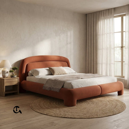 Le Cocon d'Ambre
Une chambre à coucher chaleureuse et raffinée, où la douceur du velours couleur terre cuite rencontre la naturalité du rotin et du bois clair. La lumière tamisée qui filtre à travers les rideaux en lin crée une atmosphère apaisante, idéa