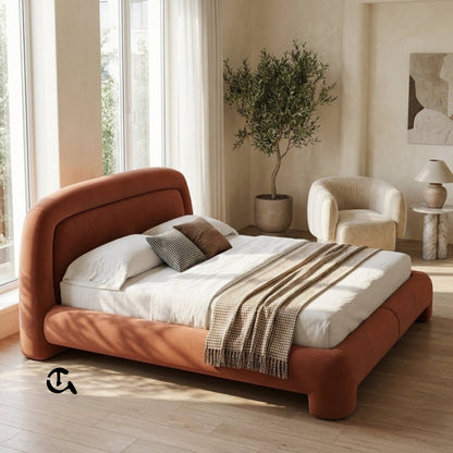 Le Cocon d'Ambre
Une chambre à coucher chaleureuse et raffinée, où la douceur du velours couleur terre cuite rencontre la naturalité du rotin et du bois clair. La lumière tamisée qui filtre à travers les rideaux en lin crée une atmosphère apaisante, idéa