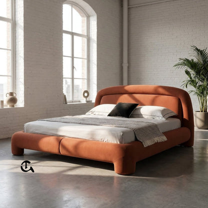 Le Cocon d'Ambre
Une chambre à coucher chaleureuse et raffinée, où la douceur du velours couleur terre cuite rencontre la naturalité du rotin et du bois clair. La lumière tamisée qui filtre à travers les rideaux en lin crée une atmosphère apaisante, idéa